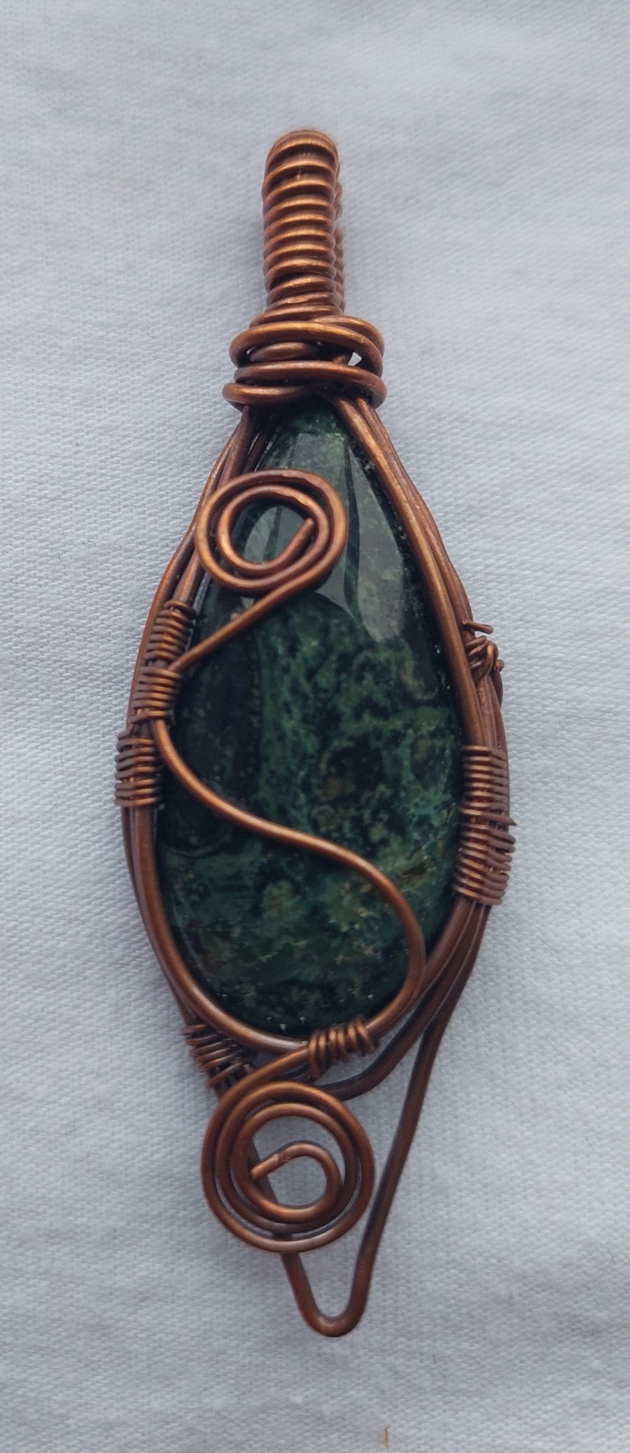Handcrafted copper wire wrapped pendant with Star Galaxy Jasper stone. 