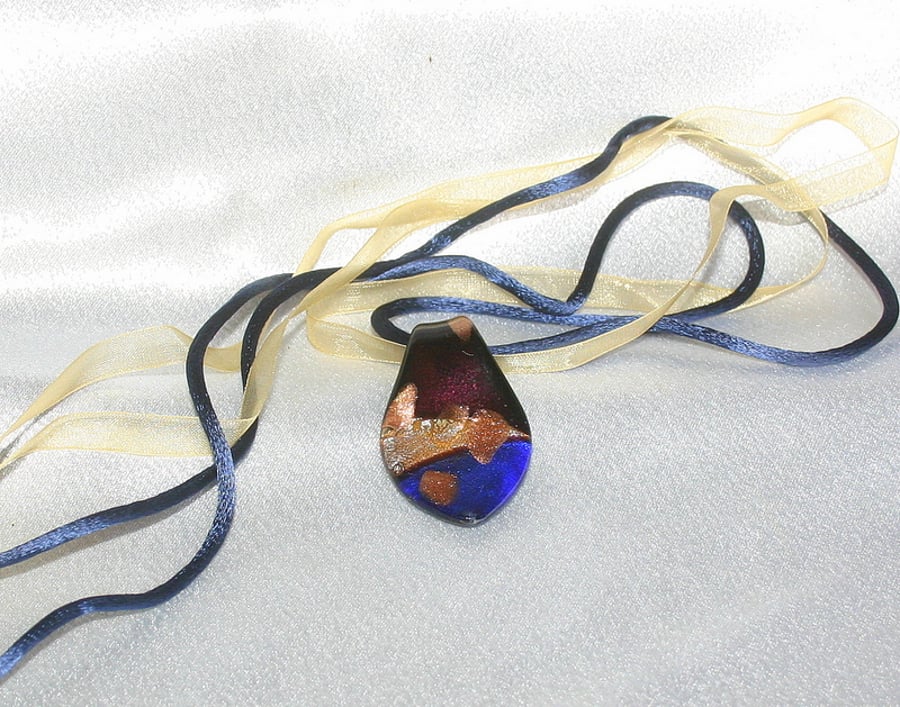 Sale 50% off. Glass pendant strung on gold ribbon and blue cord.