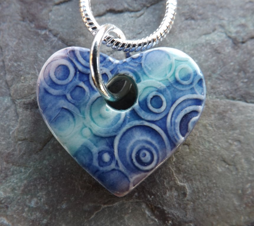 Heart shaped ceramic pendant in purple, turquoise and blue