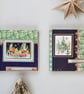  Set of two Christmas cards with a snowy town scene. 