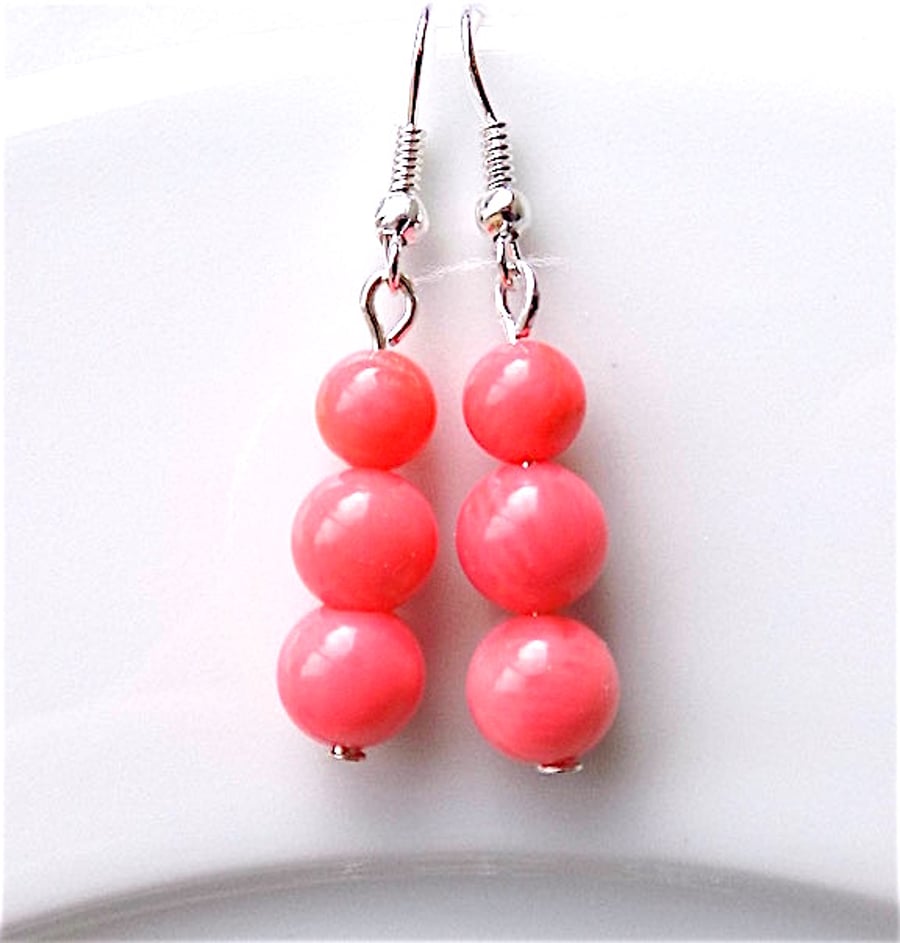 Earrings for pierced ears, sensational pink coral dangle.