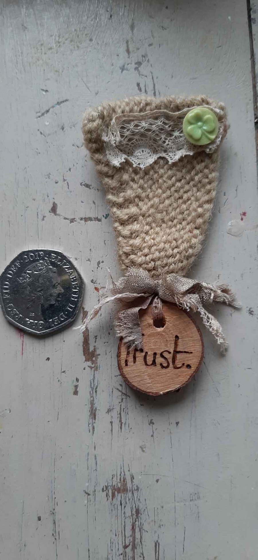 Knitted trust medal brooch
