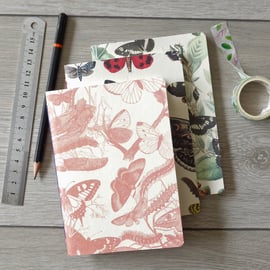 Set of three handbound small A6 notebooks with butterfly paper covers