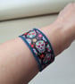 Upcycled Denim Skull Bracelet – Gothic Wristband with Mexican Calavera Ribbon