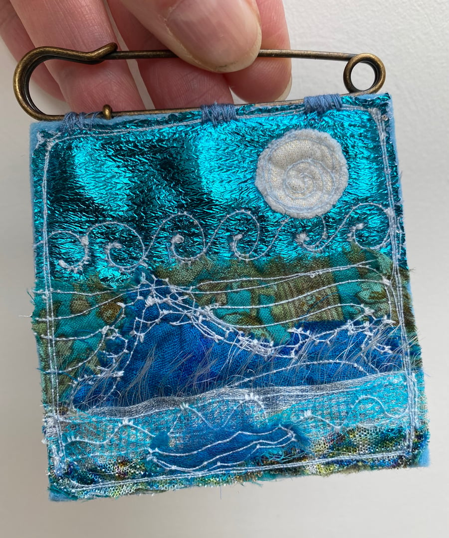 Embroidered up-cycled seascape kilt pin brooch. 