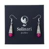 Bright pink crackle glass teardrop earrings with silver swirl detail