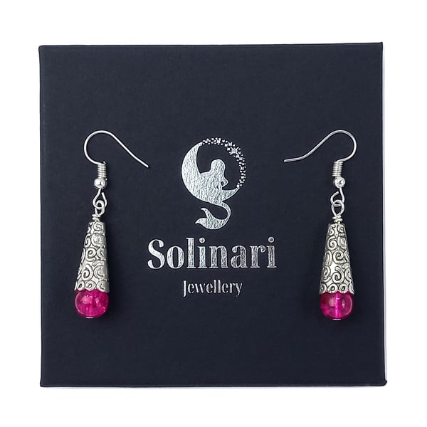 Bright pink crackle glass teardrop earrings with silver swirl detail