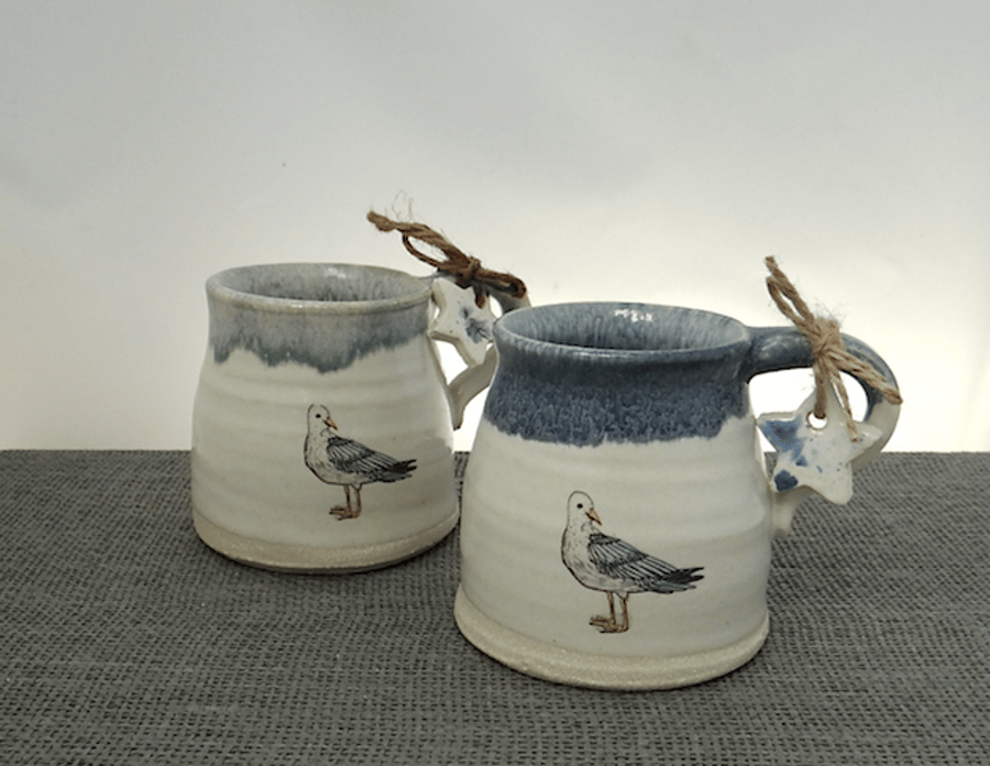 Handmade coast inspired ceramic seagull mug with sky-blue coloured rim