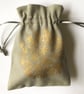 Gold floral drawstring fabric gift bag grey hand printed allium flower print - Image 1