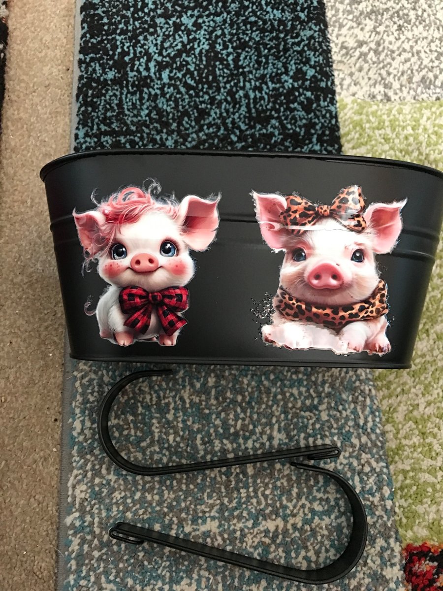 Black fence planter with cute pig motif 