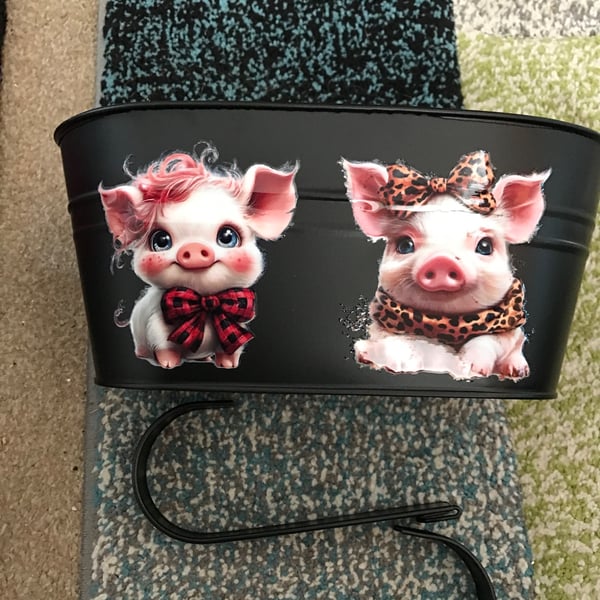 Black fence planter with cute pig motif 