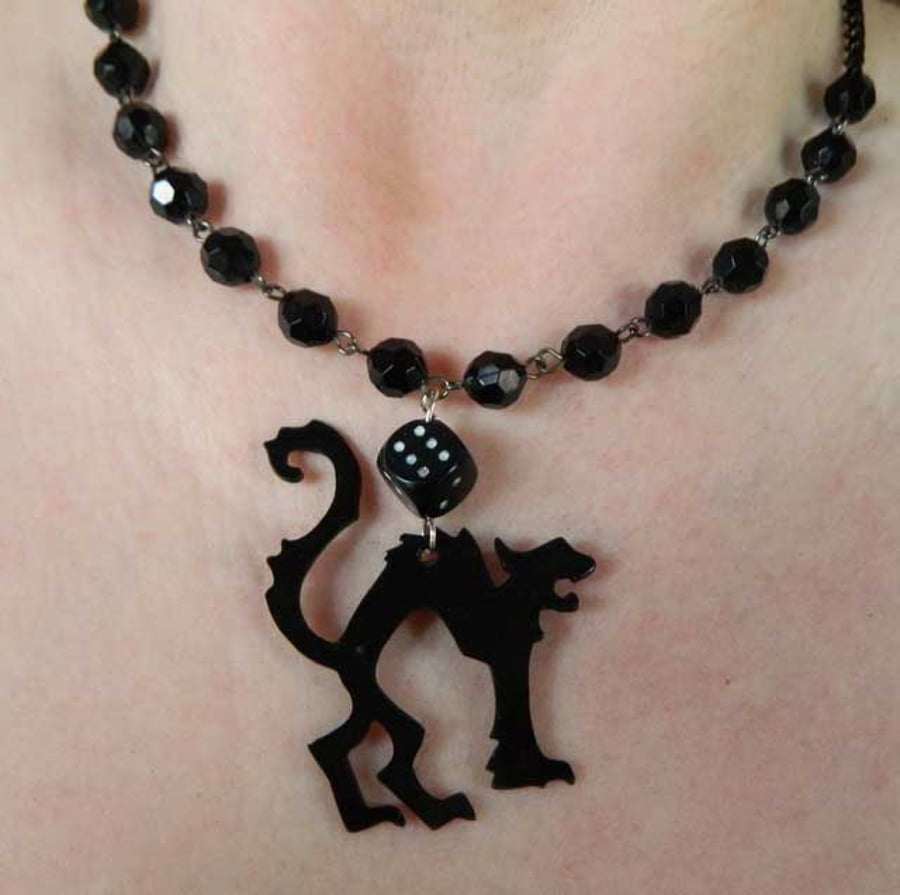 Lucky black cat and dice and rosary style beads upcycled  vinyl record