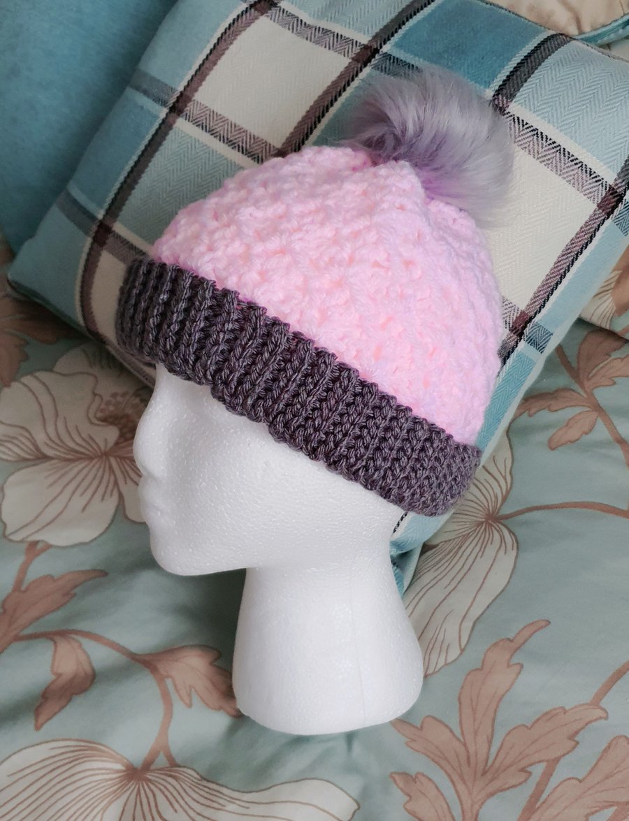 Pink crochet hat with pompom