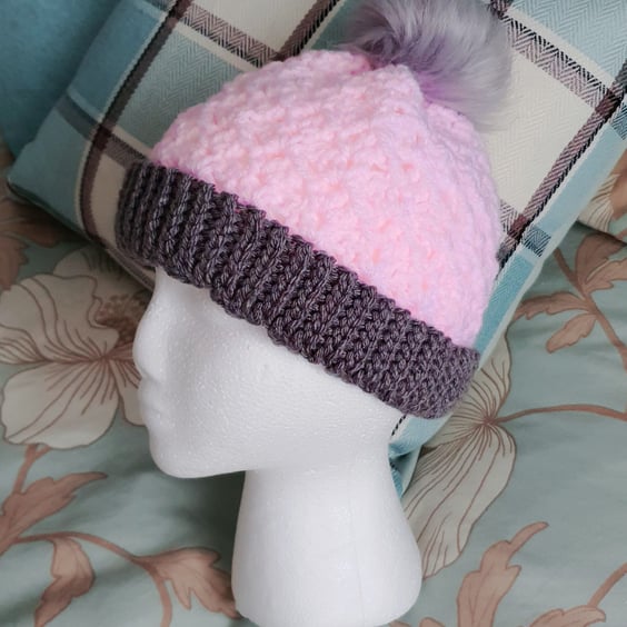 Pink crochet hat with pompom