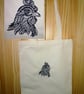 Head of a chicken embroidered on a cream tote bag