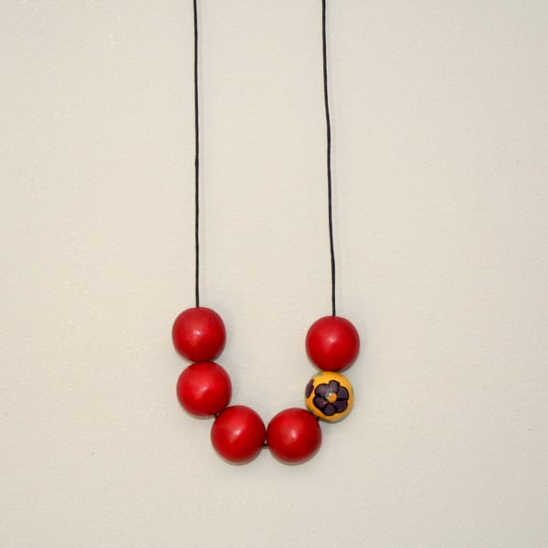 Red and yellow wooden bead necklace