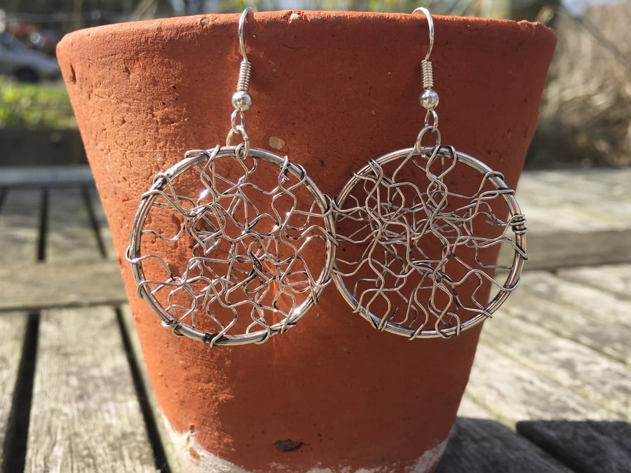 Silver plated circle earrings with zig-zag wrapped effect