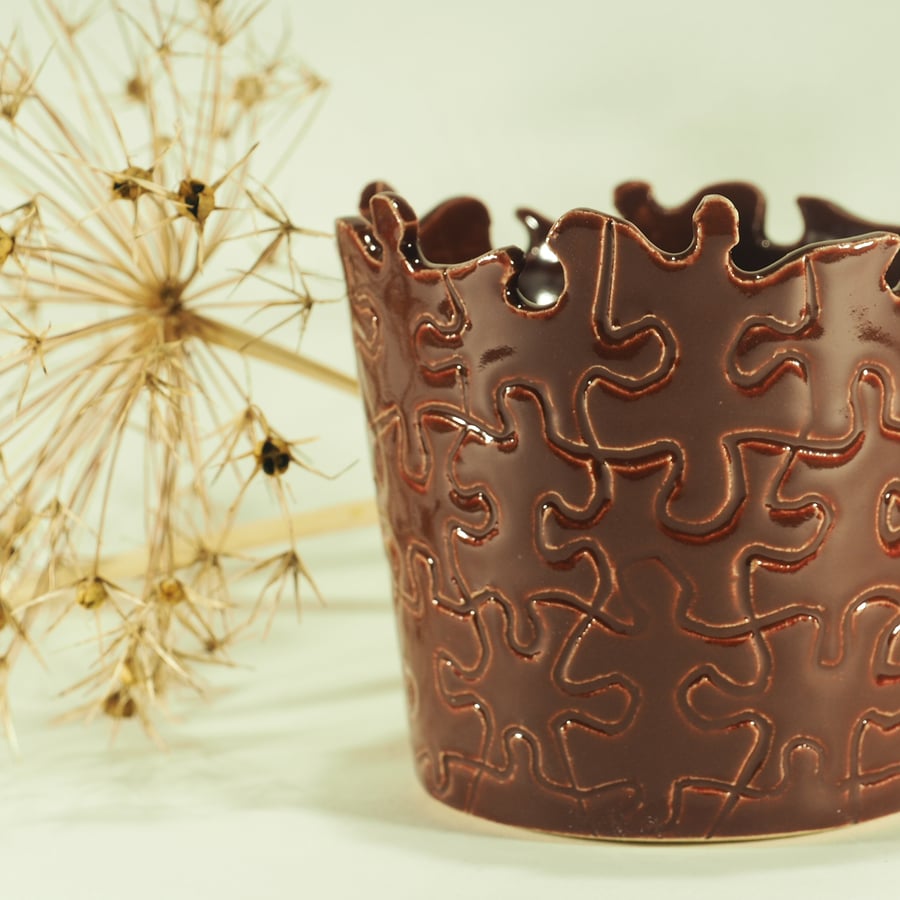 Handmade ceramic jigsaw pot in dark red