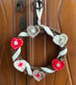 Scandi-style Christmas wreath with crocheted hearts and ribbon - Image 4