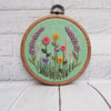 Lavender and Wildflower Hand Embroidery Hoop on Green Linen