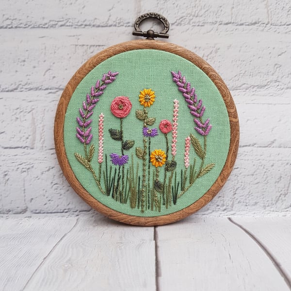 Lavender and Wildflower Hand Embroidery Hoop on Green Linen