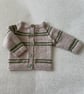 Beige baby cardigan with green stripes