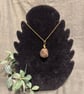 Beautiful wire wrapped brown pebble pendant on gold coloured chain.  - Image 1