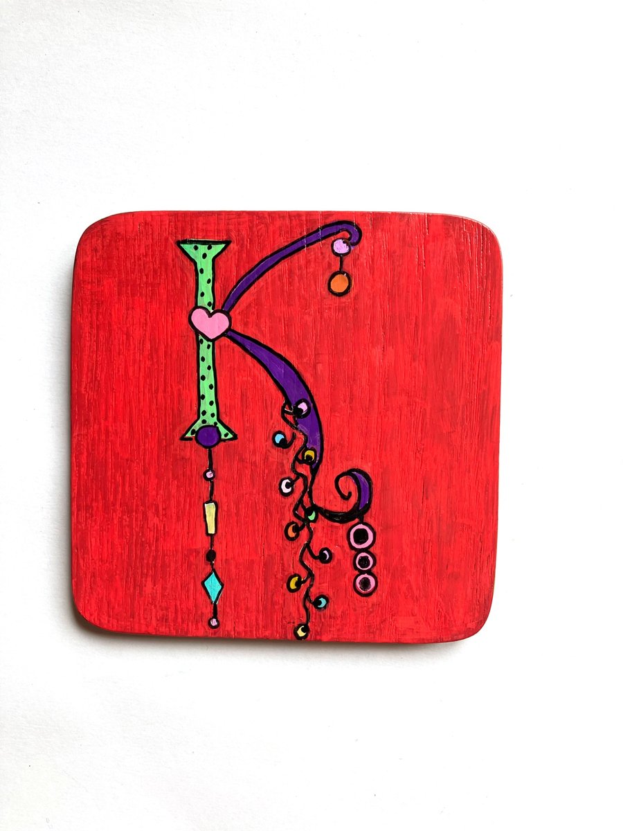 Hand painted letter K wooden coaster
