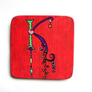 Hand painted letter K wooden coaster