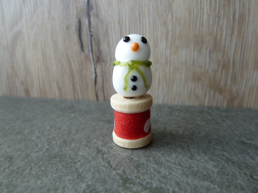 wooden spool with snowman