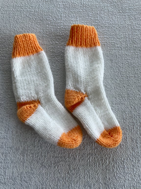Orange and white baby socks