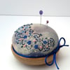 Hand embroidered pin cushion onto hand dyed silk noil and oak base