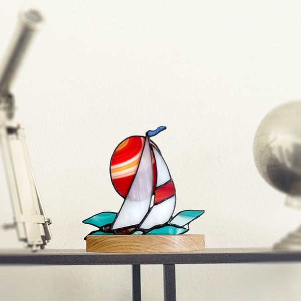 Stained Glass Sailing Boat with setting sun on a solid wood base.  Table Decor