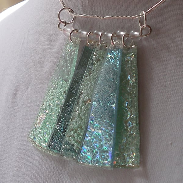 Pale metallic green and blue pendant.