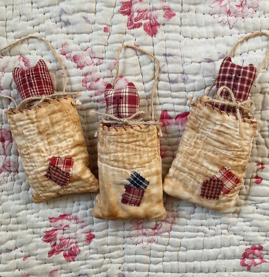 Kitten in vintage quilt pocket