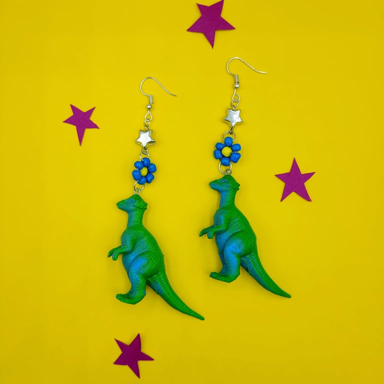 Handmade up-cycled dinosaur earrings with beaded flowers and stars 