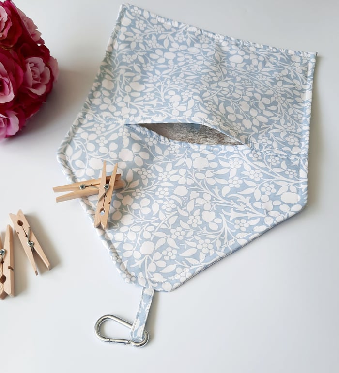 Powder blue and white floral clip on peg bag.