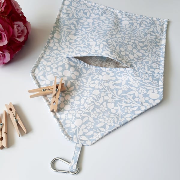 Powder blue and white floral clip on peg bag.