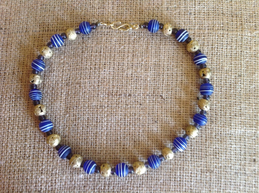 Dark blue, purple and bronze bead necklace with beads from Nepal and Africa