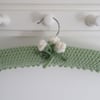 Soft green ladies coat hanger with cream buds
