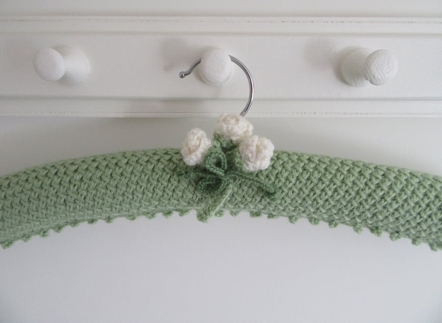 Soft green ladies coat hanger with cream buds