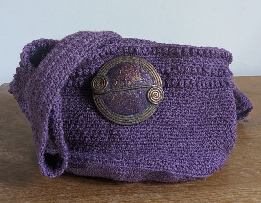 Crochet bag with celtic inspired broche