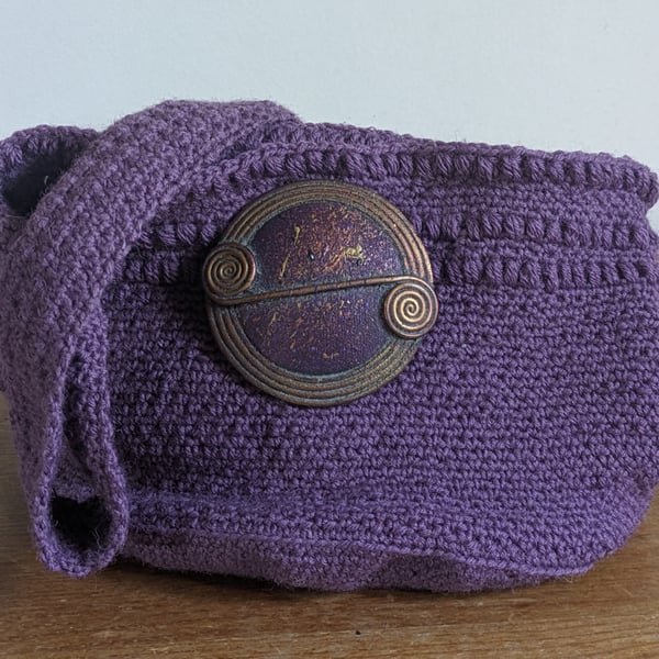 Crochet bag with celtic inspired broche