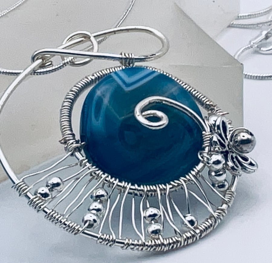 Super sodalite matte textured disc with contrasting silver spiral pendant