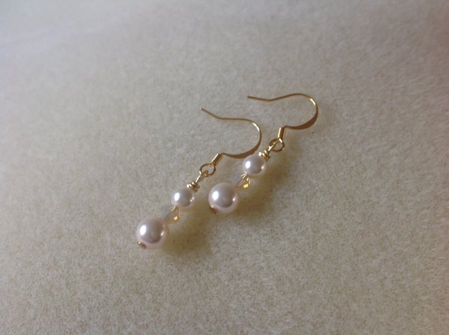 Cream rose pearl and gold crystal earrings.