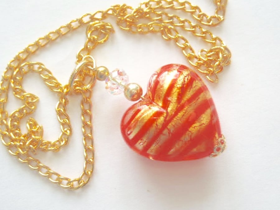 Red and gold Murano glass heart pendant with Swarovski crystal and gold chain.