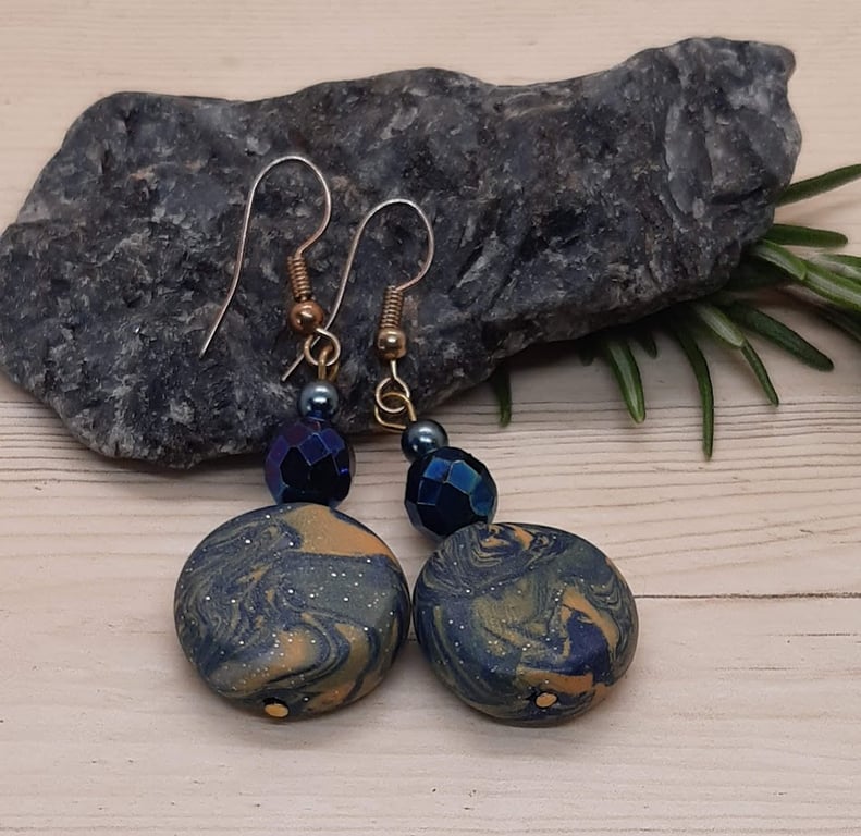 Disc shaped dangly earrings