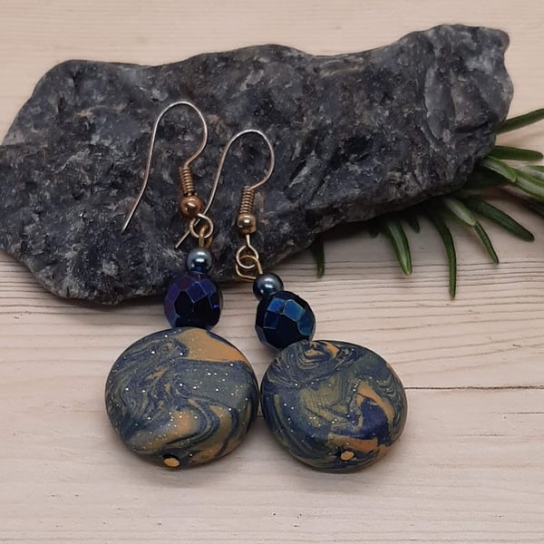 Disc shaped dangly earrings