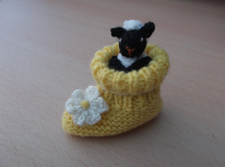 Knitted sheep in a baby boot