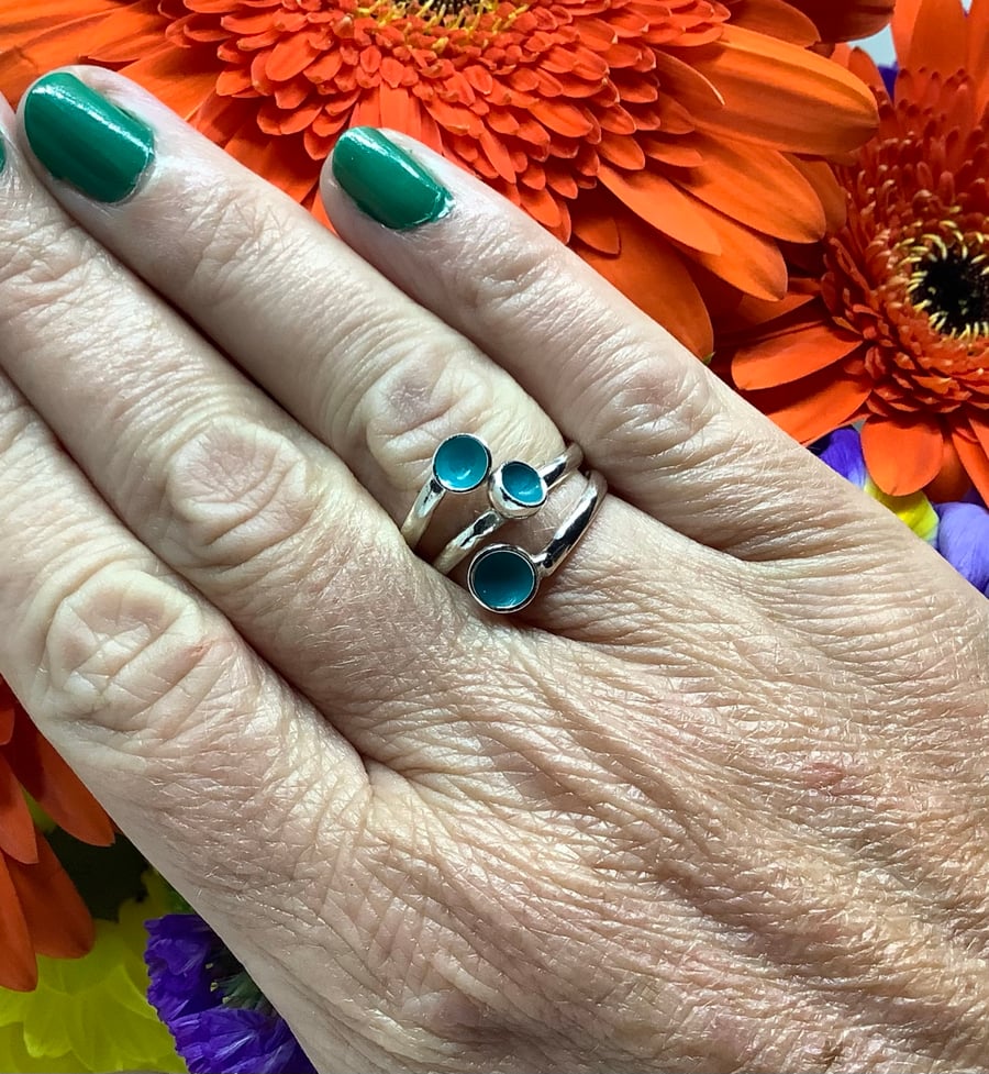 Sterling silver and turquoise blue enamel adjustable wrap ring.